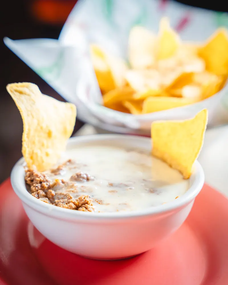 Cheese dip and bean dip with chips