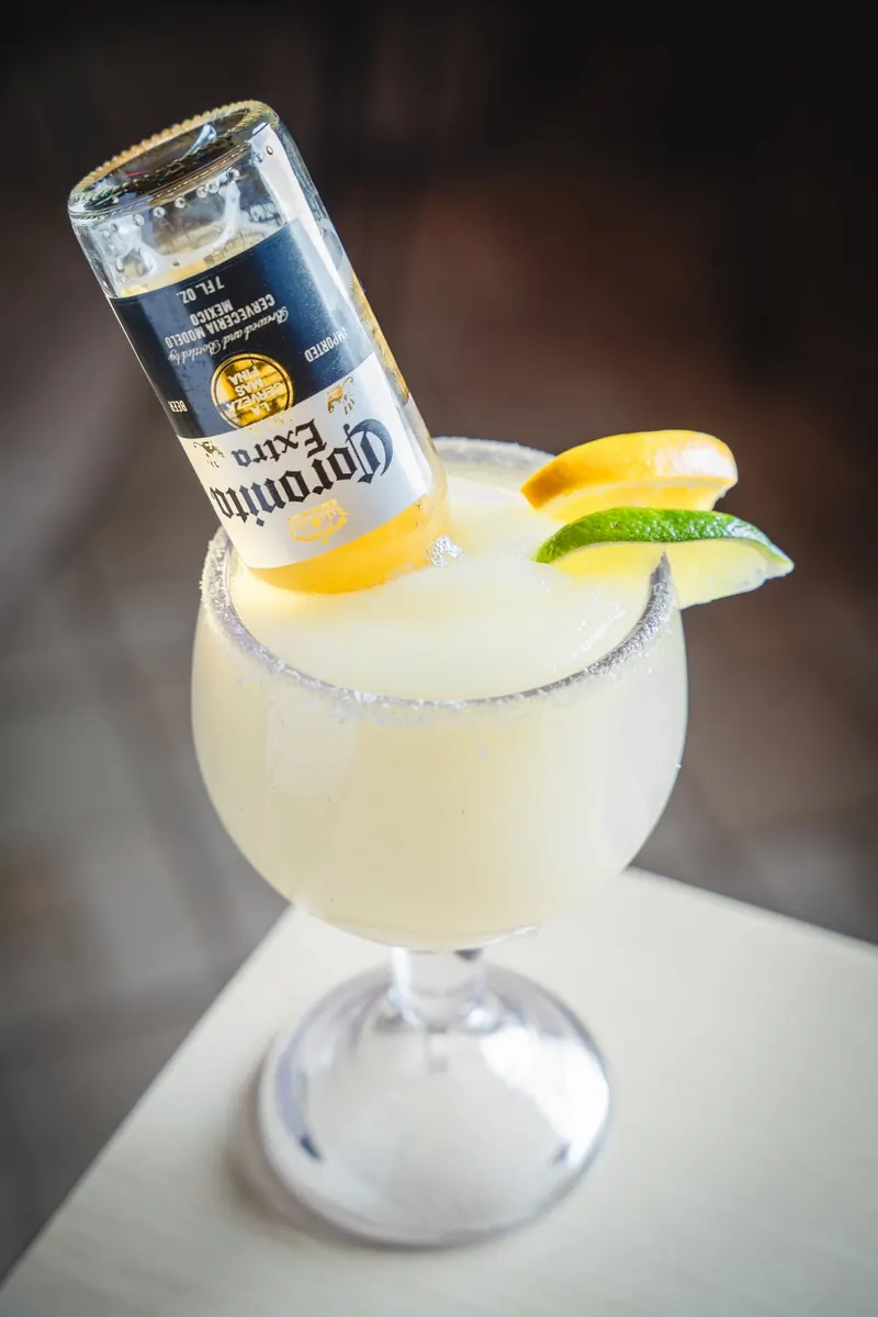 A margarita with an upturned Corona