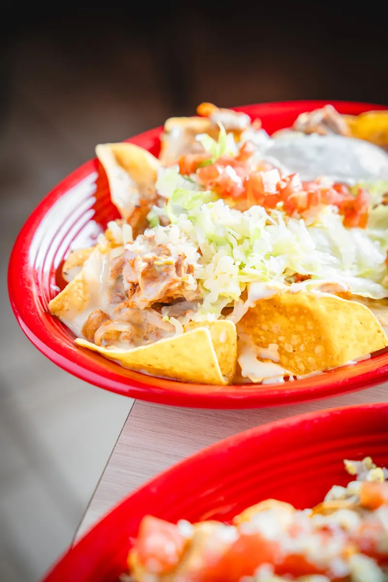 Nachos Supreme on a red platter