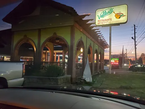 Vallarta on Wrightsboro Rd at dusk: the arched patio and the roadside sign