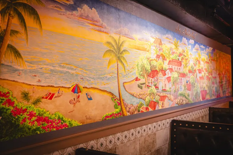 The painted beach and village mural along the Washington Rd dining room