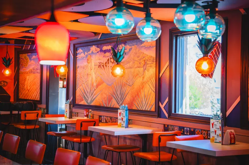 Teal glass lanterns by the windows at Washington Rd